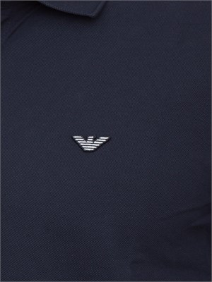 Polo blu Emporio Armani con patch logo in UOMO