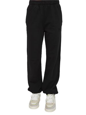 Pantaloni jogger Pinko in cotone nero effetto old con logo in tono in DONNA